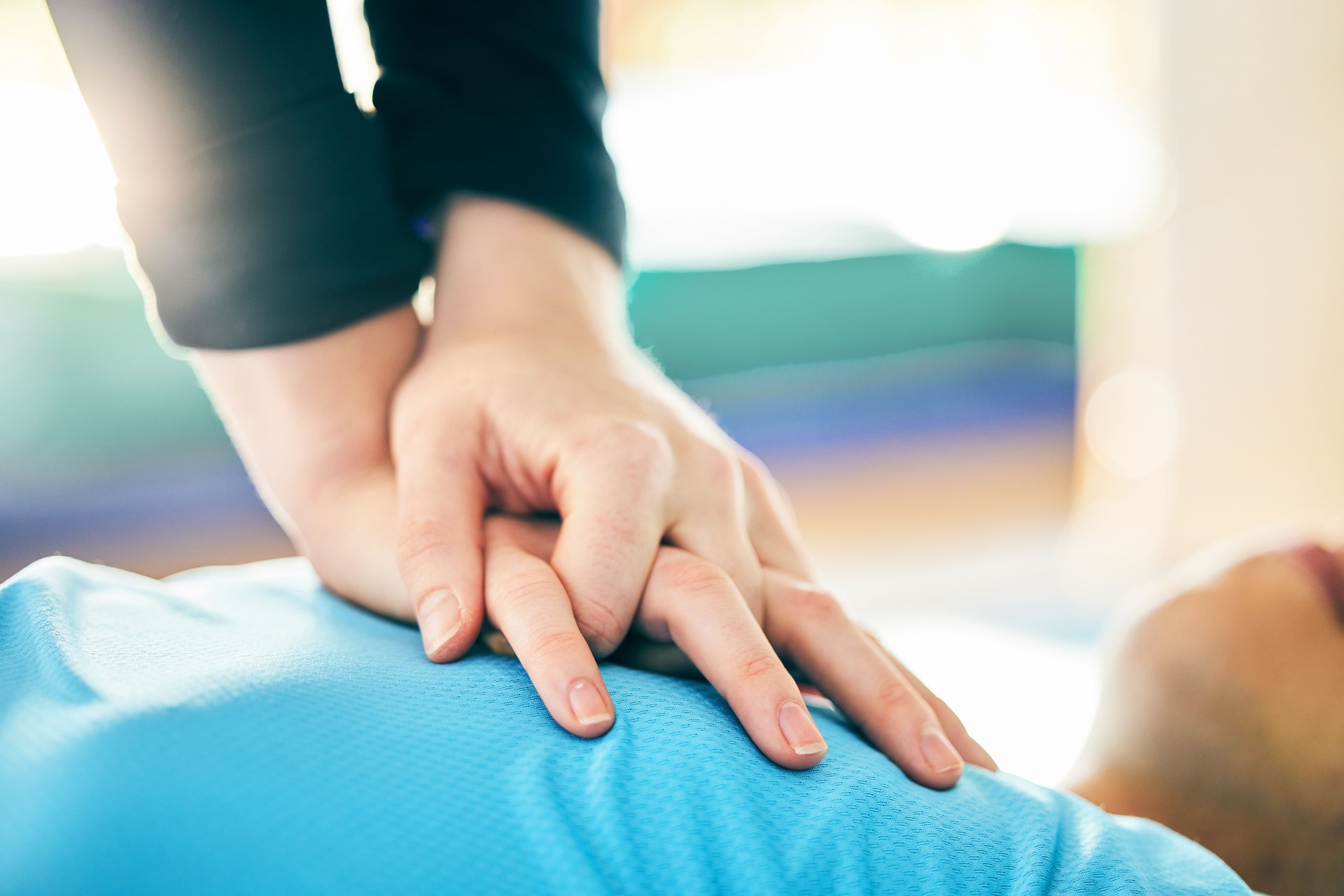 Cpr, first aid and healthcare with hands on chest of person for paramedic, medical and saving lives. Cardiac arrest, heart and injury with patient and compression for emergency, medicine and wellness